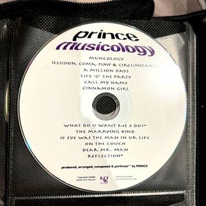 CDs - two Prince CDs.  Purple rain and musicology.